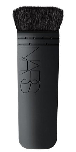 NARS Ita Kabuki contour brush with unique flat shape and dense bristles for precise sculpting and defining of cheekbones and jawlines.