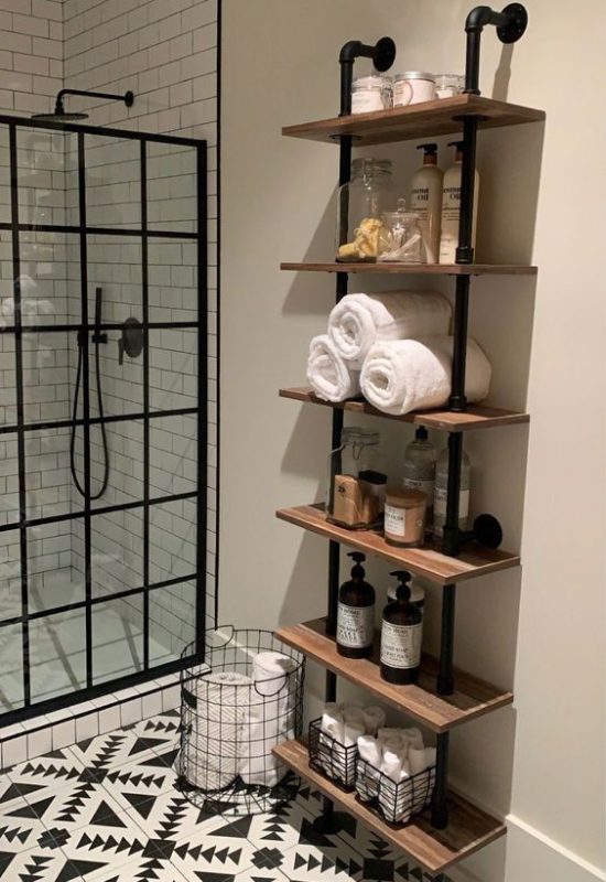 Industrial pipe shelving for modern bathroom storage ideas and small bathroom solutions.