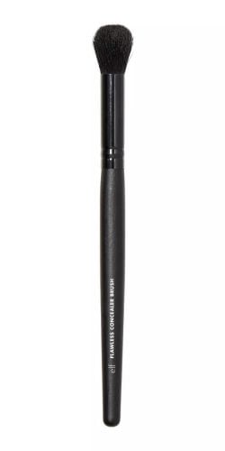 Concealer brush with smaller, dense bristles designed for precise application and blending of concealer, such as the e.l.f. Flawless Concealer Brush