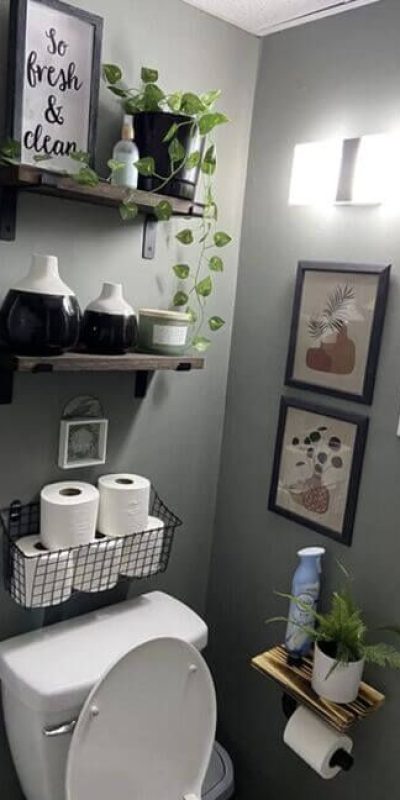 Floating shelves with plants for fresh bathroom storage ideas in small bathrooms.