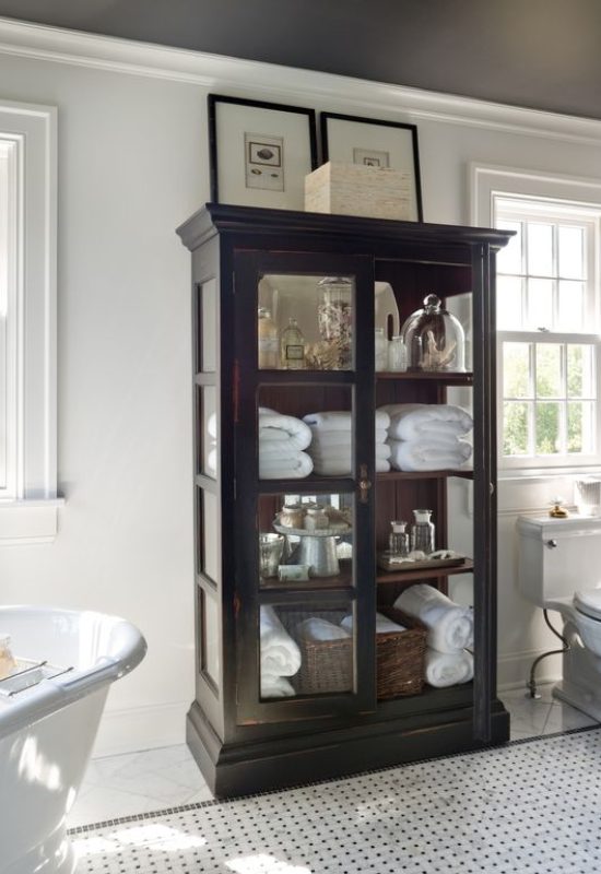 Elegant wooden cabinet with shelves for sophisticated bathroom storage ideas and small bathroom storage.