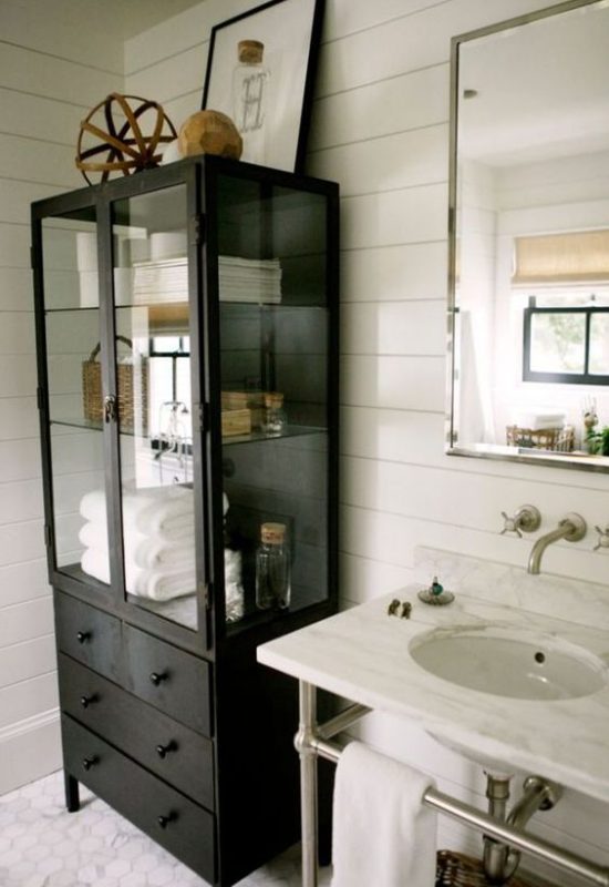 Glass display cabinet for elegant bathroom storage ideas and modern small bathroom storage.